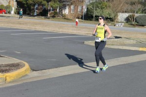 Rounding a corner to enter the track {I swear I'm running & not standing still!} Photo Credit: John Price 